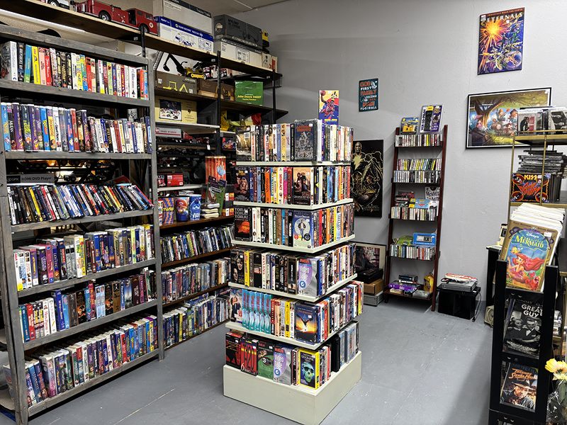 Room of shelves full of VHS tapes and DVDs