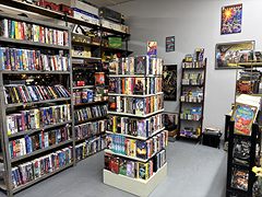 Room of shelves full of VHS tapes and DVDs